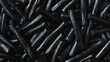 © KDG - Pile of Black Licorice Sticks Close Up for Snack or Treat
