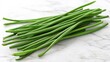 © Anuphong - Bright Green Long Beans on Marble Background
