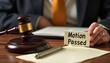 © Gyorgy - A judge's gavel and a note indicating a motion passed during a court session, symbolizing legal decisions.