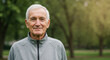 © Vasiliy - Senior man in gray athletic jacket outdoors in park. Active lifestyle and fitness concept for elderly health and retirement programs