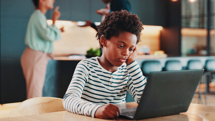 Poster - Parents, argue and child with laptop in home for online learning, education and lesson for school. Family, knowledge and boy on computer to ignore mom and dad with conflict, frustrated and tension