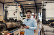 © Dusan Petkovic - Portrait of multiracial freight company inspector with tablet in hands smiling at camera at facility.