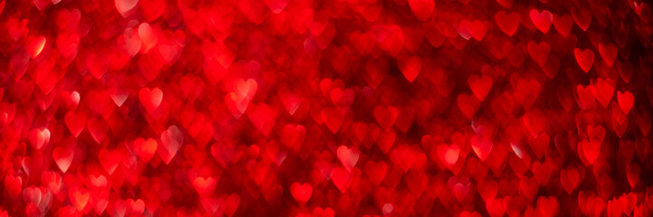 Wall Mural - Red hearts, sparkling glitter bokeh background banner, valentines day abstract defocused texture header.