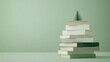 © almal - Stacked books arranged in a creative way resembling a Christmas tree on a soft green background, perfect for holiday decoration and festive reading concept