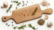 © Yopi - Wooden Cutting Board with Herbs and Spices on White Background