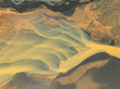© AmazingAerialAgency - Aerial view of beautiful glacial river with vibrant patterns and serene landscape, Hvolsvollur, Southern Region, Iceland.