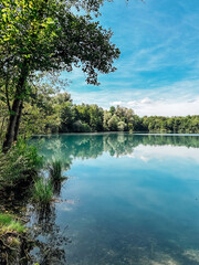 Wall Mural - lake with a blue sky in the background