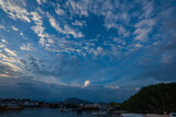 white clouds in the blue sky The sun shines through. .birds flying in the sky The wind that blows through.The clouds move and change shape with the force of the wind. .beautiful nature in the sky