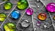 © Auon - Close up of dewdrops on a grayscale leaf each drop capturing a vivid rainbow in selective color refracting light beautifully