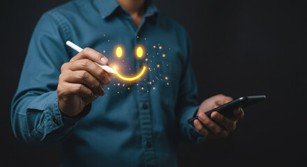 Wall Mural - customer satisfaction: man draws happy face with stylus on digital device, showing positive feedback