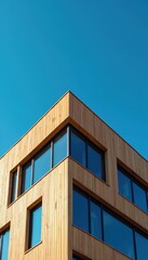 Poster - Modern building exterior wood panel facade, windows. Blue sky background, minimalist architecture design. New residential house, office, urban city skyline. Modern construction, real estate, property