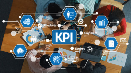 Poster - An overhead view of a professional team discussing KPIs and strategies at a wooden table filled with charts, graphics, and digital tools highlights collaboration and productivity. Amity