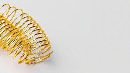 Poster - Minimalist golden spring with a spiraled design and a radiant tip creating a unique visual representation of elegance