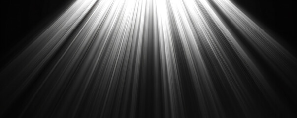 Poster - A black and white photo of a light shining on a dark background. The light is coming from the top left corner and is shining down on the dark background