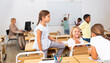 © JackF - Children students of primary school friendly chatting on break sitting at desks