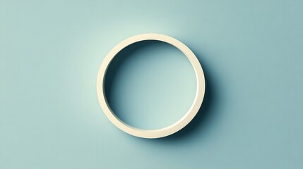 Poster - a simple, circular object on a soft blue background, showcasing minimalistic design and clean lines.
