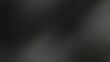 © Tohirin_ThaherAF - Dark blurred abstract noise grainy blur background with subtle light gradients, ideal for use in minimal designs, presentations, or modern visual content requiring neutral texture.
