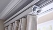 © Pannee - Drapery track system for motorized curtains shown from underneath in close-up