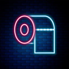 Fototapete - Glowing neon line Toilet paper roll icon isolated on brick wall background. Colorful outline concept. Vector