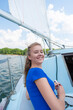 © danmorgan12 - Sea Travel Concepts. One Winsome Happy and Smiling Positive Caucasian Sailor Woman Relaxing on White Yacht At Daytime on Board.