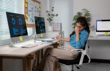 Aufkleber - Stressed businesswoman having headache and massaging her nose bridge while working with financial data in office