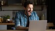 © art - Excited Man in Denim Shirt Celebrating Laptop News