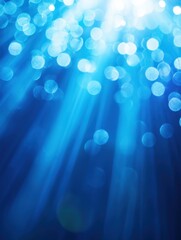 Poster - Ethereal blue light beams and bokeh circles create a serene underwater ambiance with a dreamy and magical feel for stock photography