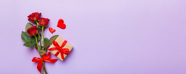 Wall Mural - Valentine's day composition with rose flower, red heart and gift boxes on table. mother day and birthday greeting, copy space, top view