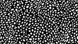 © theo - Abstract monochrome pattern with irregular white oval shapes over a black background