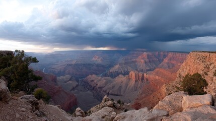 Aufkleber - Storm clouds roll over majestic canyon walls as the final sunlight bathes the cliffs in fiery orange, creating a breathtaking view of nature's beauty