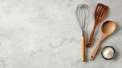 Aufkleber - A collection of cooking utensils like a metal whisk, tongs, and wooden spatula placed on a countertop with ample space for text