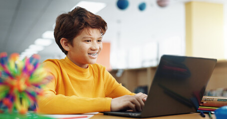 Poster - Student, library and child on laptop for e learning, remote education and online class with knowledge. Virtual school, development and happy pupil typing on technology for growth on teaching platform