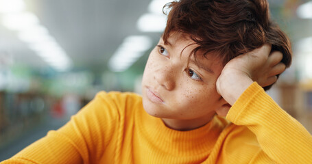 Poster - Thinking, child and student in library at school for planning, ideas and study of learning solution. Bored, boy and lazy kid with thoughts for education challenge, problem solving and exam reflection