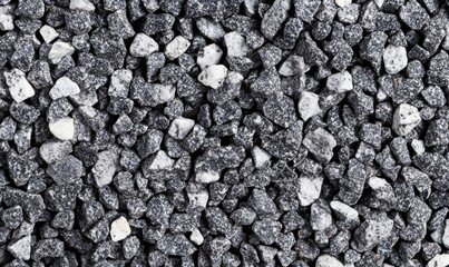 Poster - Close up view of gray and white stones creating a textured background for various applications.