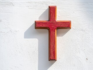 Poster - Minimalist Red Wooden Cross Casting Gentle Shadow on White Textured Wall in Simple and Elegant Artistic Composition for Various Creative Projects