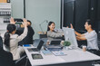 © ARMMY PICCA - Cheerful meeting room, businesspeople celebrate with handshaking. Successful project was completed before the deadline. Business partnership and collaboration in project management. Habiliment