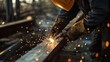 © aubriella - Welder cutting metal beams at a construction site. Featuring technical skill and sparks