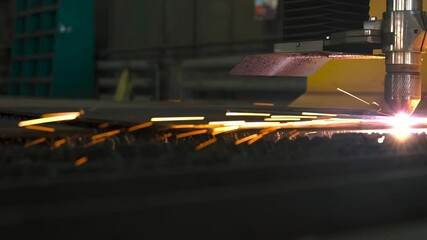 Fototapete - Laser cutting crafts precise metal parts in fabrication workshops