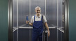 © stokkete - Portrait of a plumber standing in an elevator