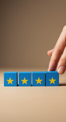 Wall Mural - four star rating: hand adding a star to blue wooden blocks. feedback, review, excellence, success.