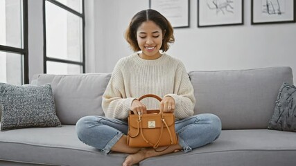 Poster - A woman sits on a couch holding a purse, ready for an outing.