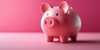 © Georg - Cute pink piggy bank on a bright pink background showcasing savings and financial planning