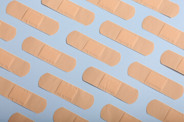 adhesive bandage plaster on on a coloured background, the concept of protection