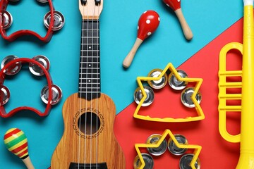 Flat lay composition with different toy musical instruments on color background