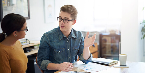 Fototapete - People, desk and paper with talking for startup or business, creative or editor for magazine. Team, entrepreneurs and working at table with documents for publishing, collaboration or teamwork on job