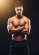 © peopleimages.com - Fitness, portrait and man in studio with serious muscle, confidence and workout in health, wellness and power. Flexing, pride and strong bodybuilder on black background for exercise, body and care
