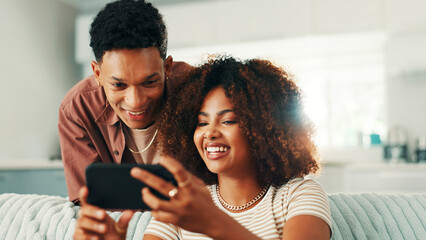Poster - Phone, couple and funny laugh at home with internet, online joke and browsing for meme. Man, woman and living room sofa for social media post, comedy or sharing video for entertainment in house