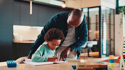 Poster - Black family, father and child with homework in home for school assignment, writing development and helping. Happy people, man or boy kid with book for creative lesson, education support and learning