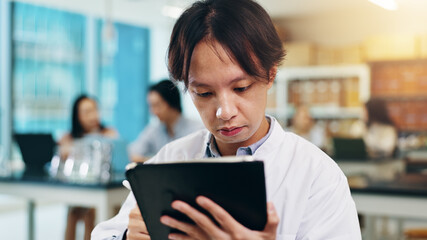 Poster - Tablet, studying and man in university lab for science lecture with notes for exam or test. Digital technology, education and Japanese male student with biology research for college assignment.