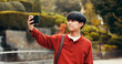 © peopleimages.com - Man, travel and selfie in city of Japan, photography and capture memory on trip for freedom. Male person, online app and tourist in town for new experience, blogging and internet for social media